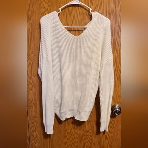 Ivory sweater with tied knot back